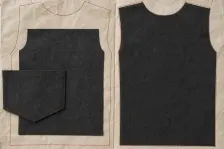 Two paper pattern outlines stitched in rust-red, the left holding a dark cloth panel that falls well inside the paper on every side with its pocket overhanging the edge, the right holding one that fills the outline exactly
